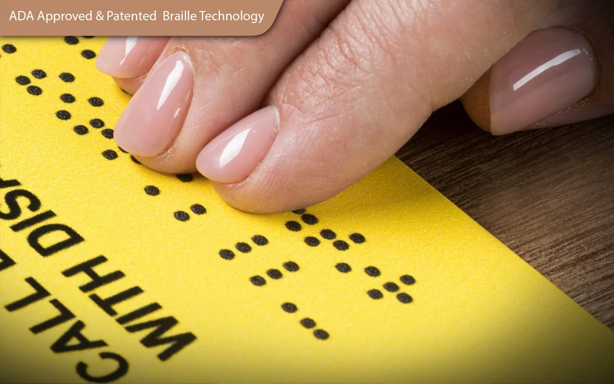 A visually impaired person confidently using tactile signage inside a modern public building